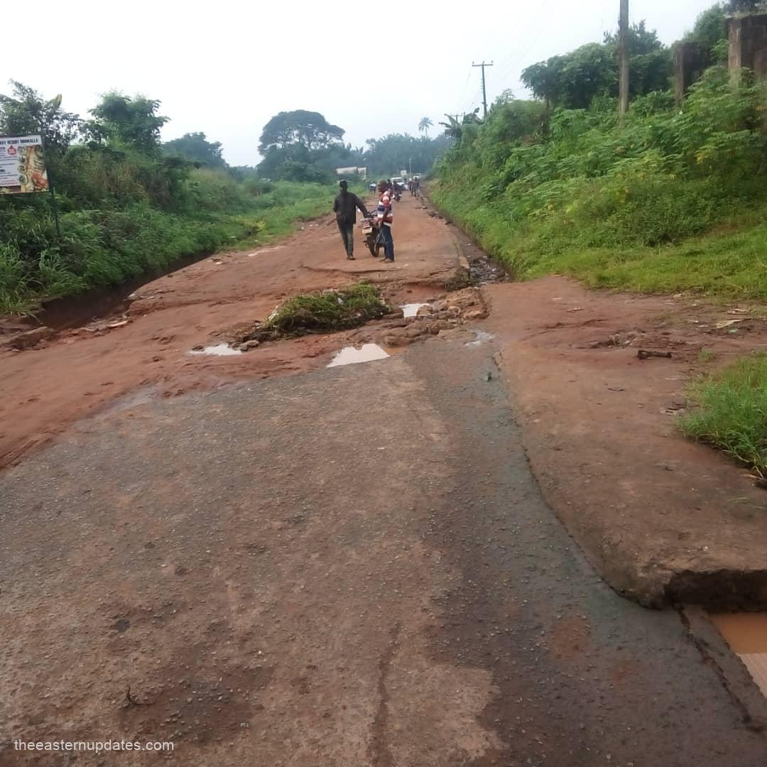 A visual representation of a deteriorating section of the Umuakura-Ubowalla Road, where erosion is visibly eating into the asphalt and rendering the thoroughfare unmotorable.