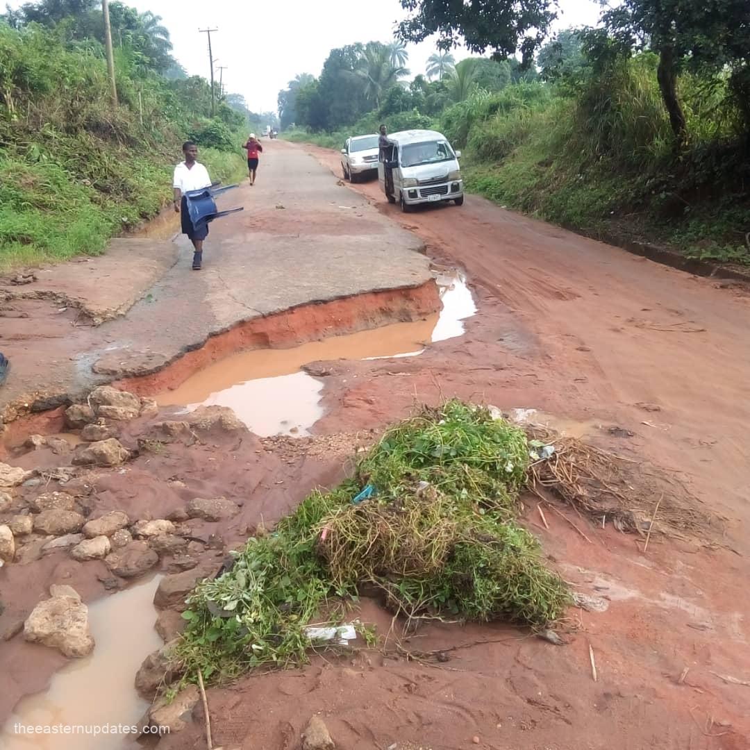 A visual representation of a deteriorating section of the Umuakura-Ubowalla Road, where erosion is visibly eating into the asphalt and rendering the thoroughfare unmotorable.